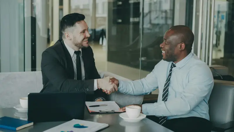 Business owners shaking hands